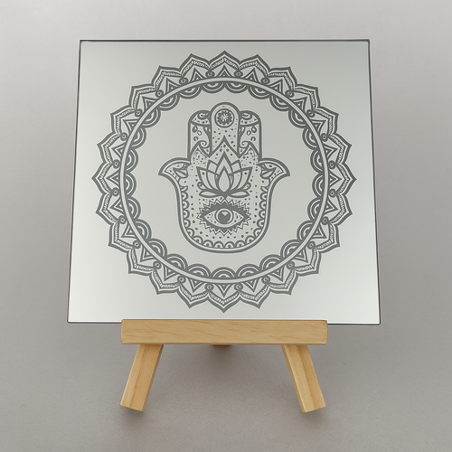 Engraved glass mirror with a detailed hamsa and mandala design