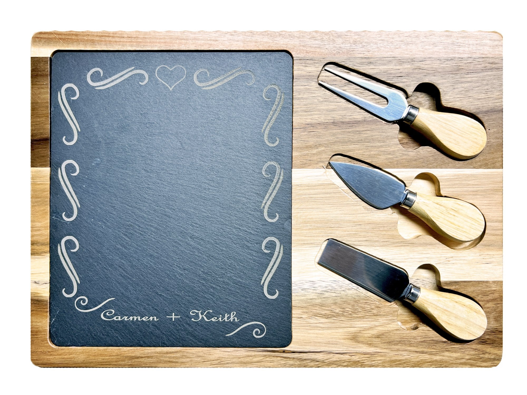 Charcuterie board with Carmen and Keith script names and flourish border engraved into the slate