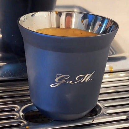 Navy 80ml Espresso Mug engraved with the initials "G.M." sitting on a breville barista express with a double shot of espresso